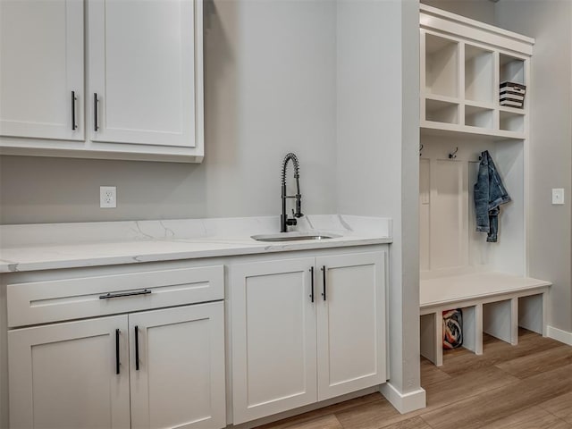 interior space with light hardwood / wood-style floors and sink