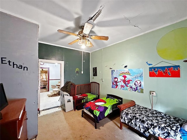 bedroom featuring ceiling fan and ornamental molding