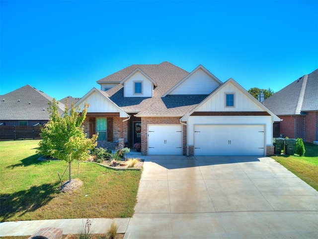 view of front of house featuring a front yard and a garage