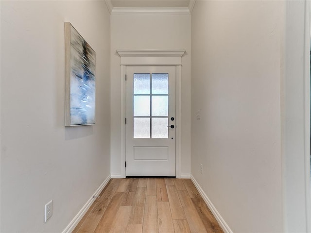 doorway with ornamental molding and light hardwood / wood-style flooring