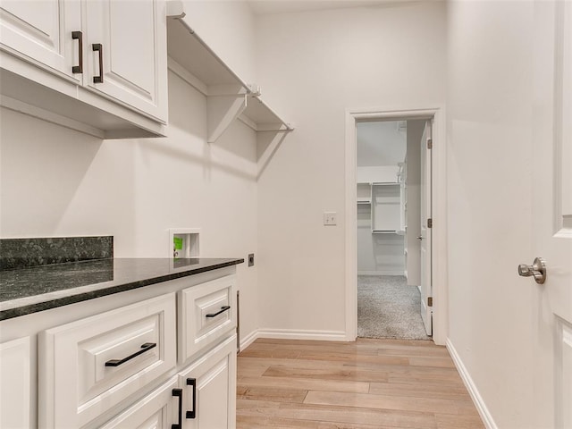 spacious closet featuring light hardwood / wood-style floors