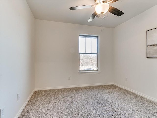 empty room with ceiling fan and carpet flooring