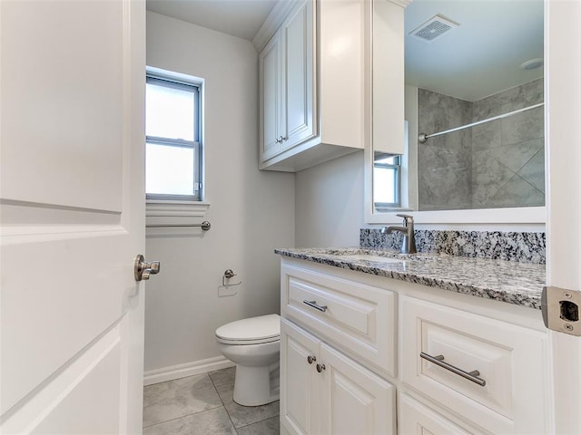 bathroom with tile patterned floors, toilet, and vanity