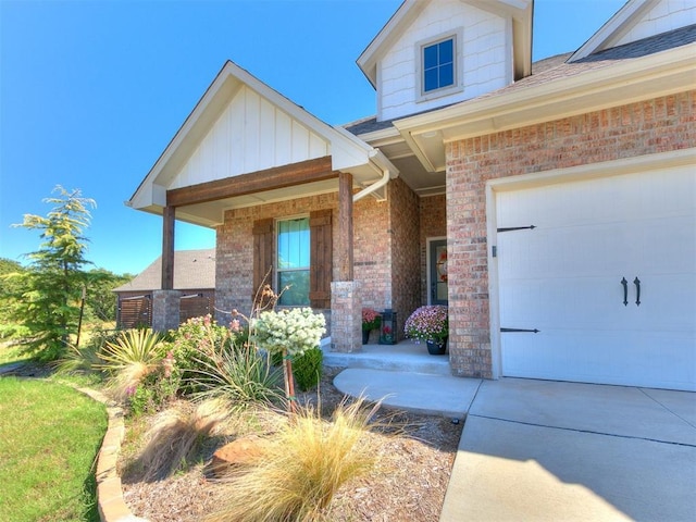 view of exterior entry with a garage