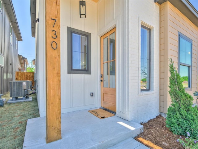 doorway to property featuring central AC