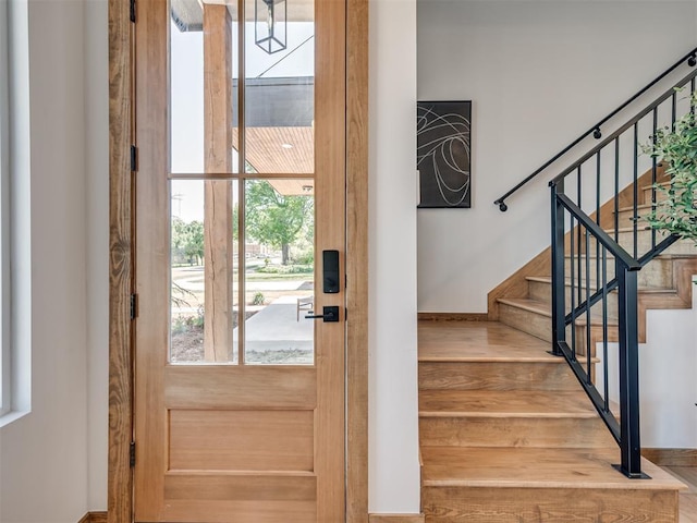 entryway with wood-type flooring