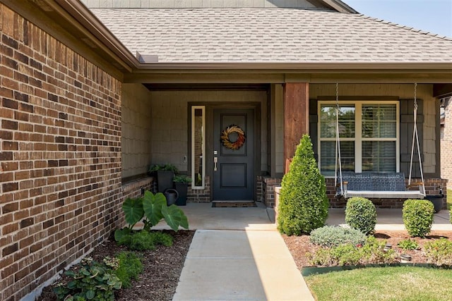 entrance to property featuring covered porch