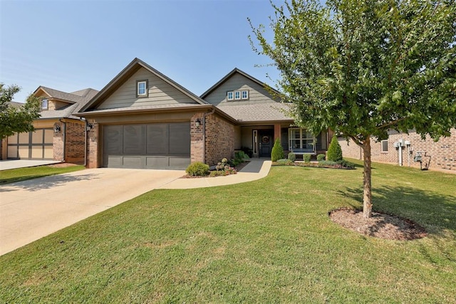 view of front of home with a front yard and a garage