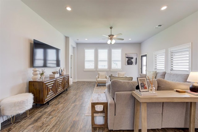 living room with ceiling fan and dark hardwood / wood-style floors