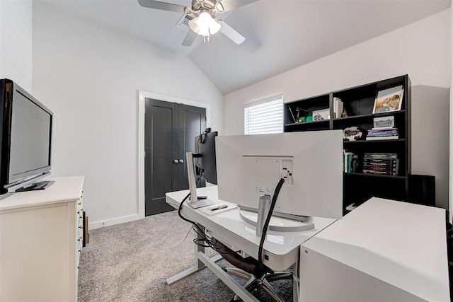 office area featuring light carpet, vaulted ceiling, and ceiling fan