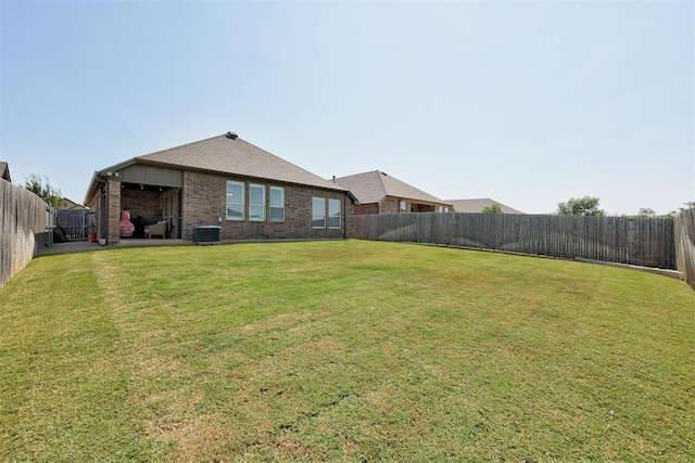 view of yard with central AC