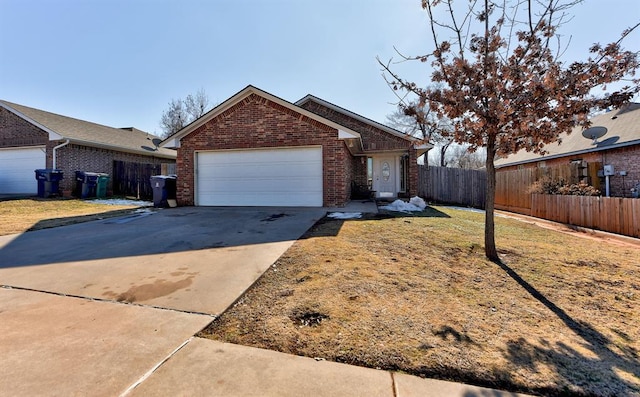 ranch-style house with fence, a front yard, brick siding, concrete driveway, and an attached garage