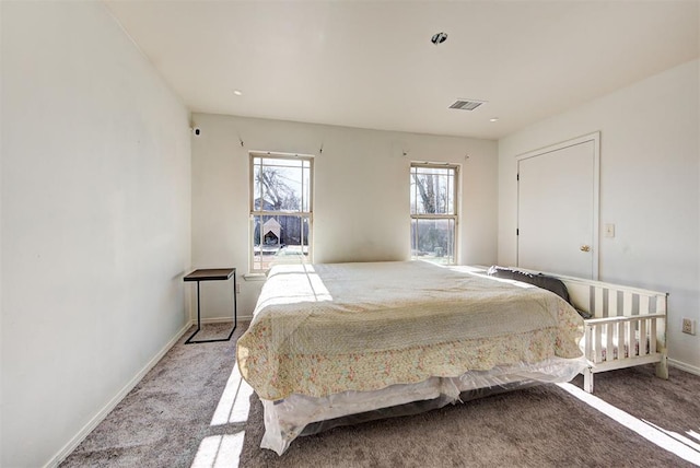 bedroom featuring baseboards, carpet, and visible vents