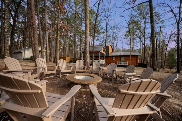 patio terrace at dusk with a fire pit