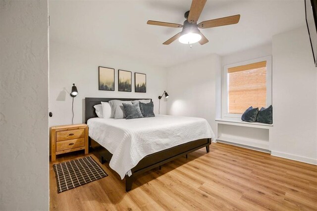 bedroom featuring hardwood / wood-style floors and ceiling fan