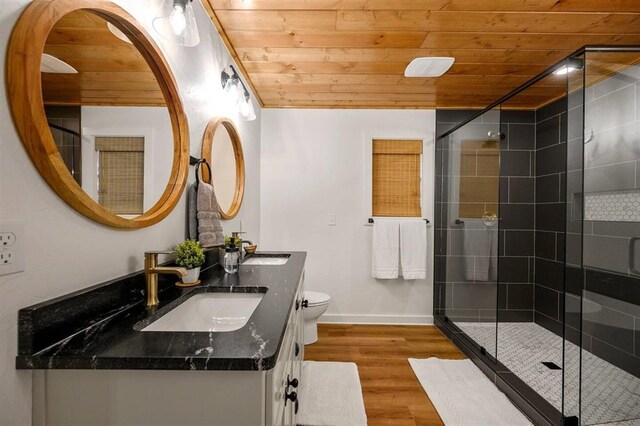 bathroom with walk in shower, vanity, wooden ceiling, hardwood / wood-style floors, and toilet