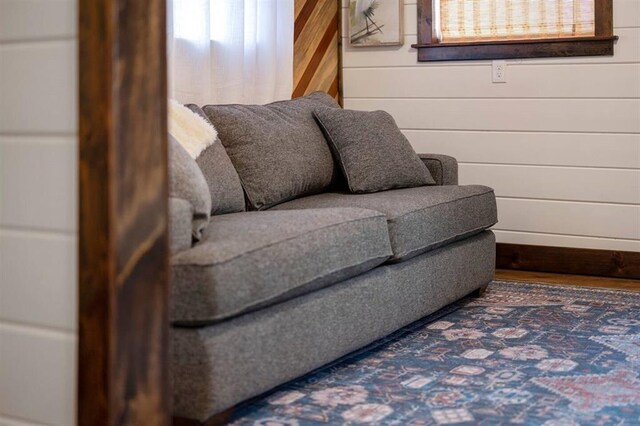 sitting room with wood walls