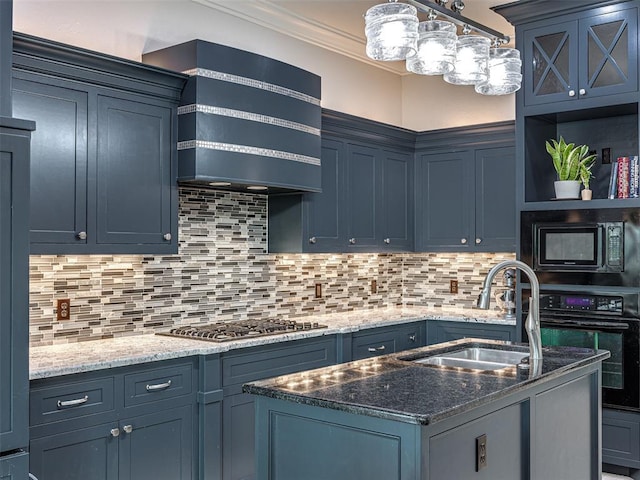 kitchen featuring black appliances, blue cabinetry, tasteful backsplash, and sink