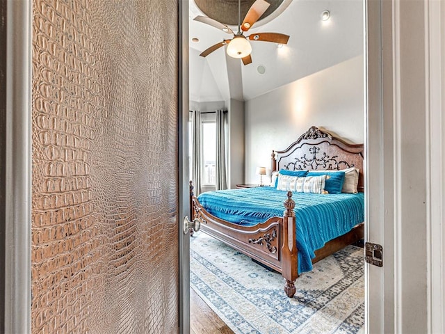 bedroom featuring ceiling fan and vaulted ceiling