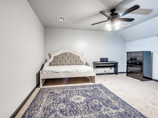 bedroom featuring ceiling fan, vaulted ceiling, and carpet flooring