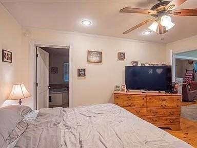 bedroom featuring ensuite bath and ceiling fan