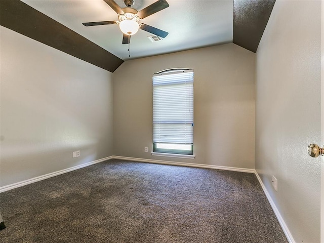 carpeted empty room with ceiling fan and vaulted ceiling