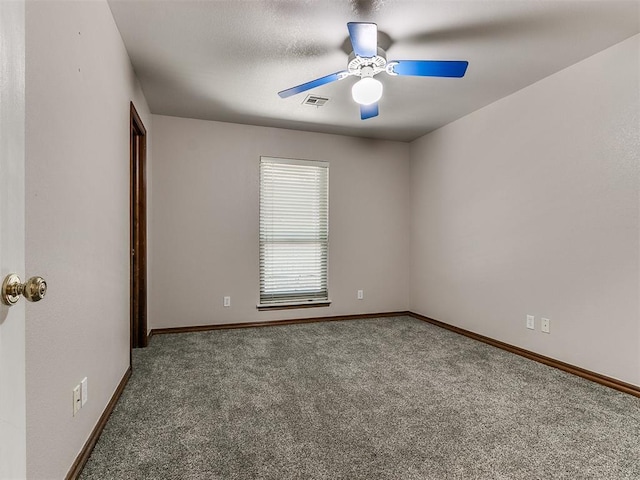 carpeted empty room featuring ceiling fan