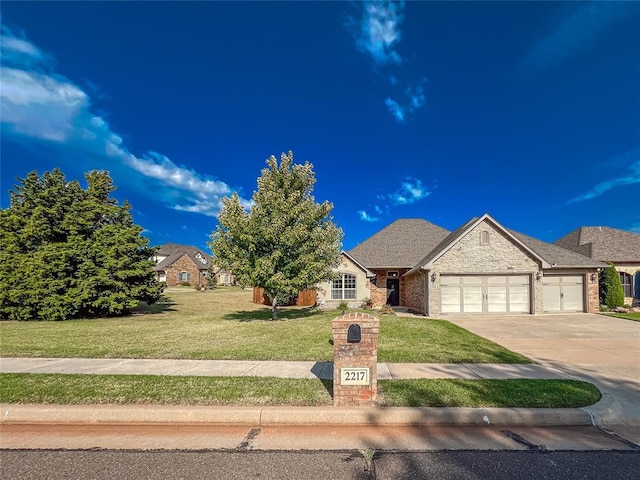 view of front of property featuring a garage and a front yard