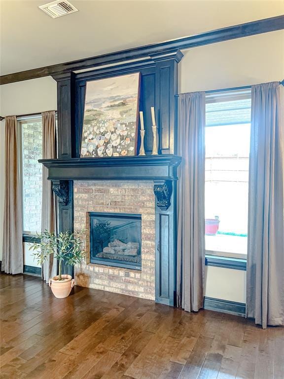 room details with a fireplace and hardwood / wood-style flooring