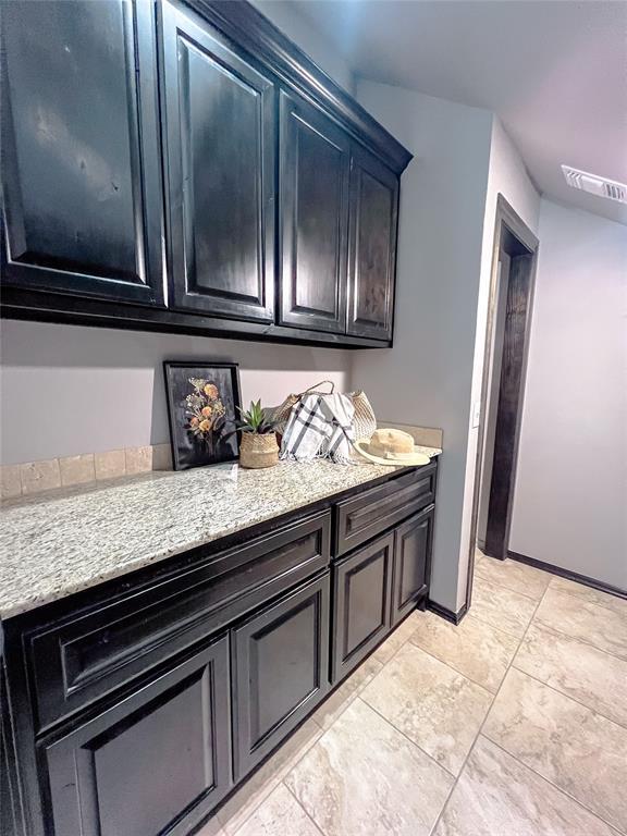 kitchen featuring light stone countertops