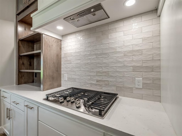 kitchen with white cabinets, stainless steel gas cooktop, open shelves, and recessed lighting