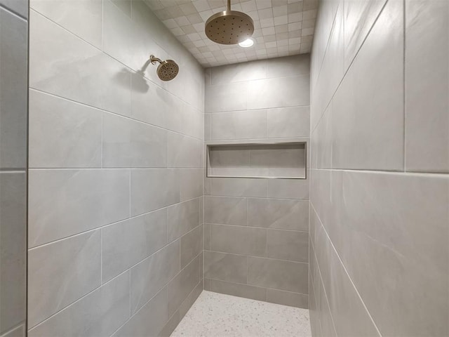 full bathroom with a tile shower