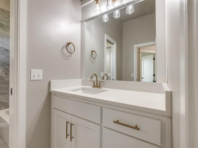 full bathroom with vanity and a bath