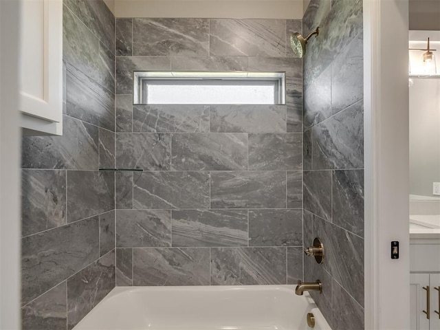 bathroom with tub / shower combination and vanity