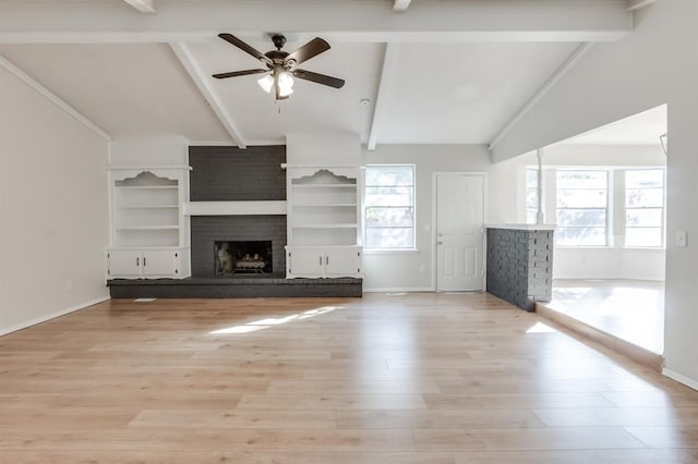 unfurnished living room featuring vaulted ceiling with beams, ceiling fan, light wood-type flooring, and a fireplace