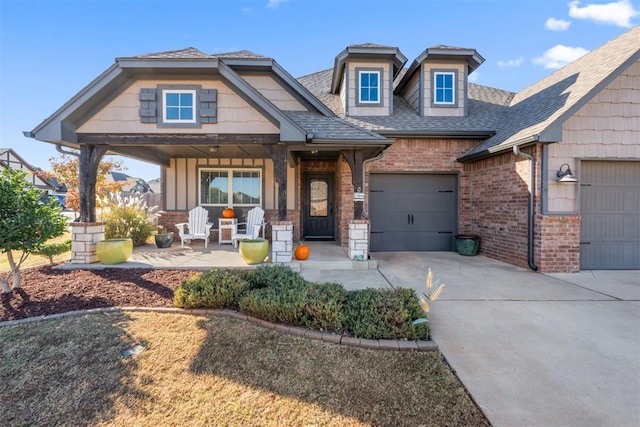 craftsman-style home featuring a porch and a garage