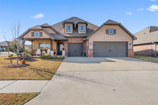 craftsman-style house featuring a front yard and a garage