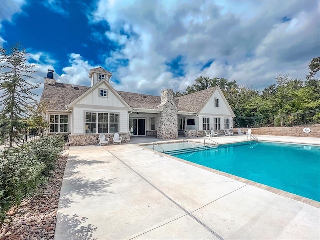 view of pool with a fenced in pool, a patio area, and fence