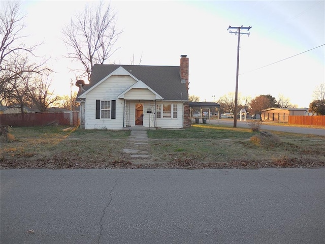 view of front of property featuring a carport