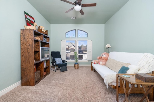 sitting room with carpet flooring and ceiling fan