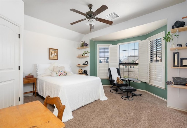 carpeted bedroom with ceiling fan and lofted ceiling