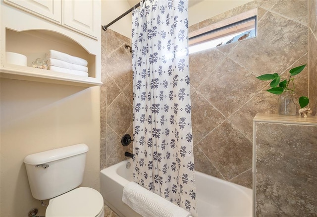 bathroom featuring toilet and shower / bath combo with shower curtain