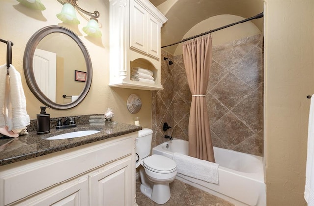 full bathroom with tile patterned flooring, shower / bath combo, vanity, and toilet