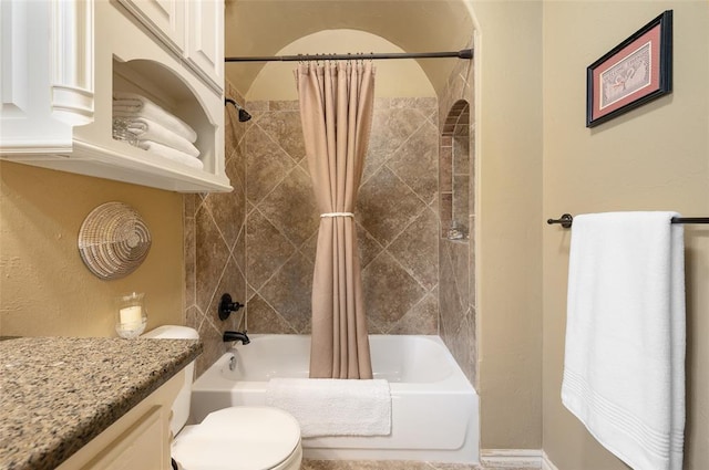 full bathroom with shower / tub combo with curtain, vanity, and toilet