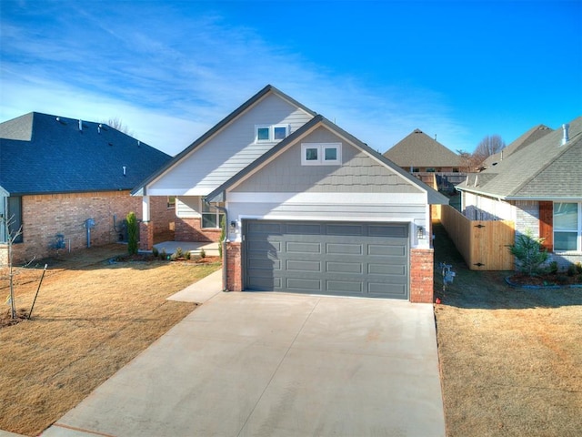 craftsman-style home featuring a front lawn and a garage