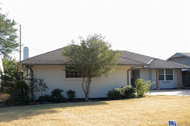 view of home's exterior with a lawn