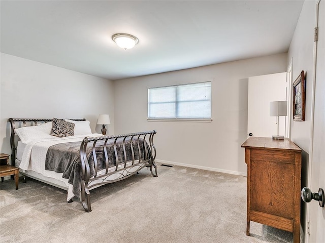 bedroom with light carpet