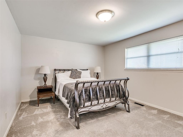 bedroom with light carpet