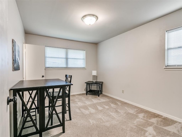 view of carpeted dining area