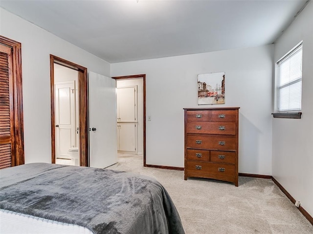 carpeted bedroom with ensuite bathroom